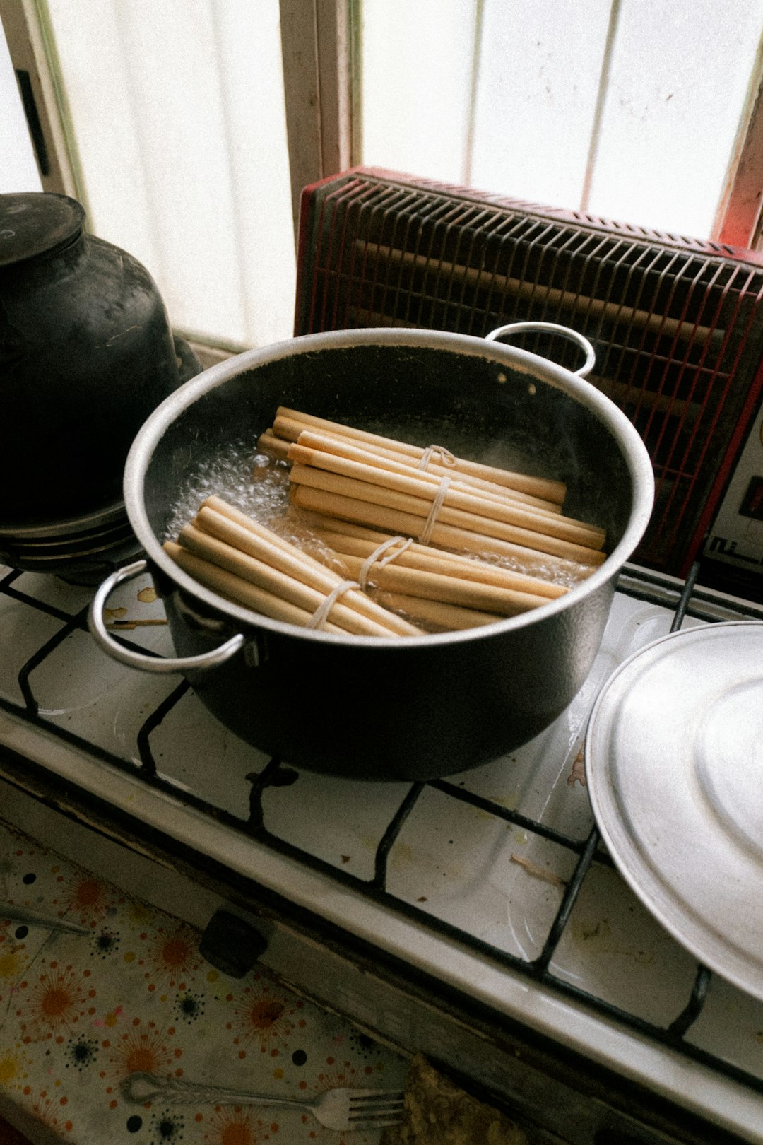 services-03 wooden-chopsticks-boiling-in-a-pot-of-water-pjwwpswfdrm